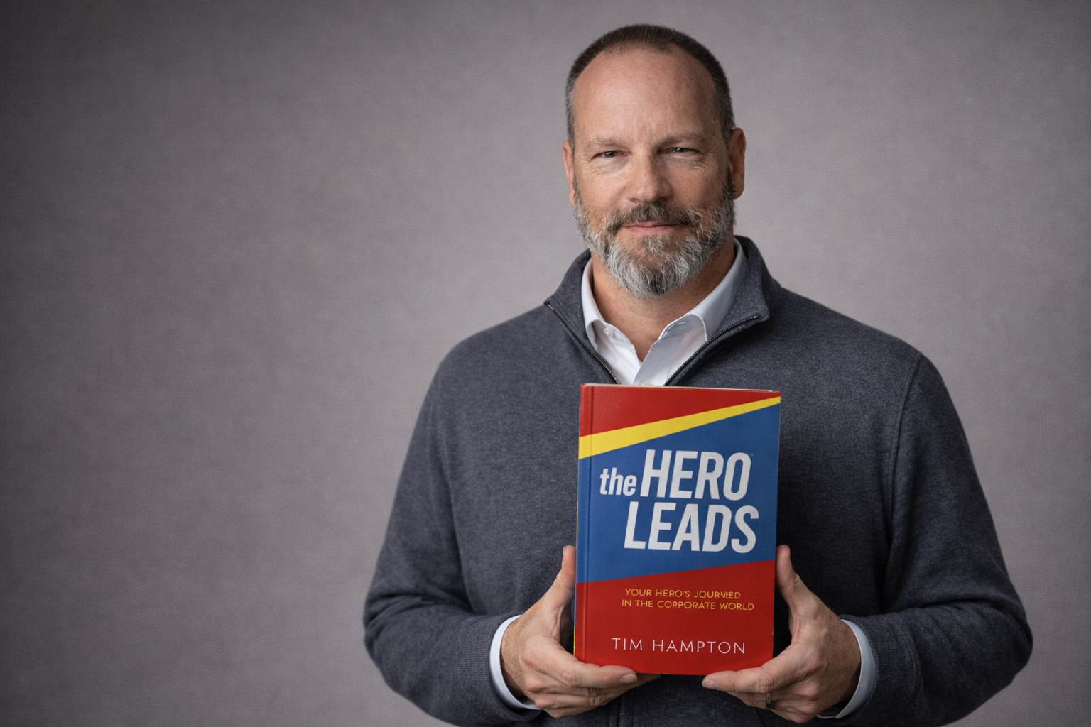 Tim Hampton holding The Hero Leads
